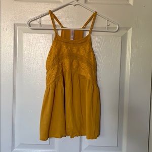 Mustard yellow top with a flowy bottom